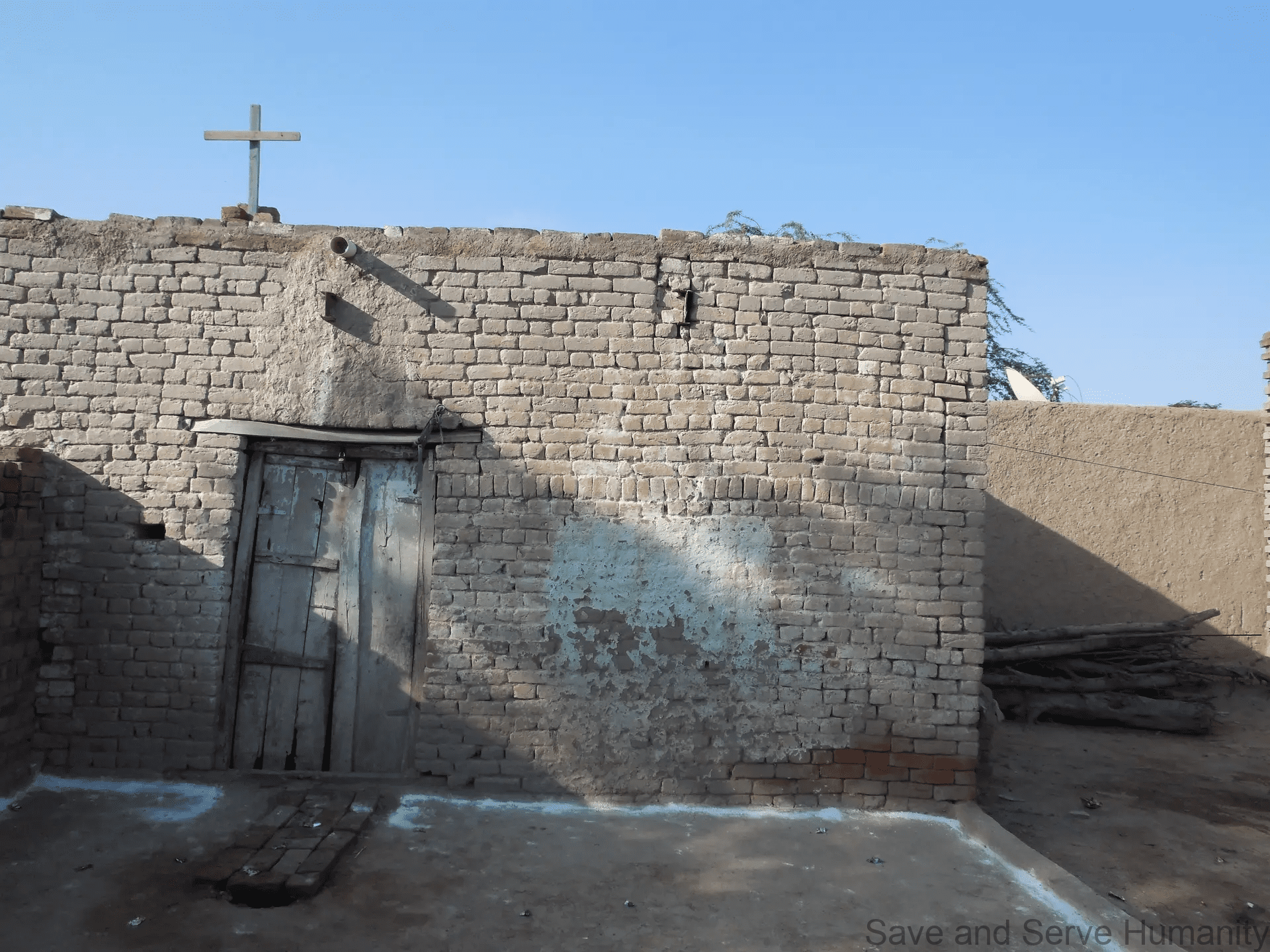 Earlier worship room connected to the Laweray Village church construction story.